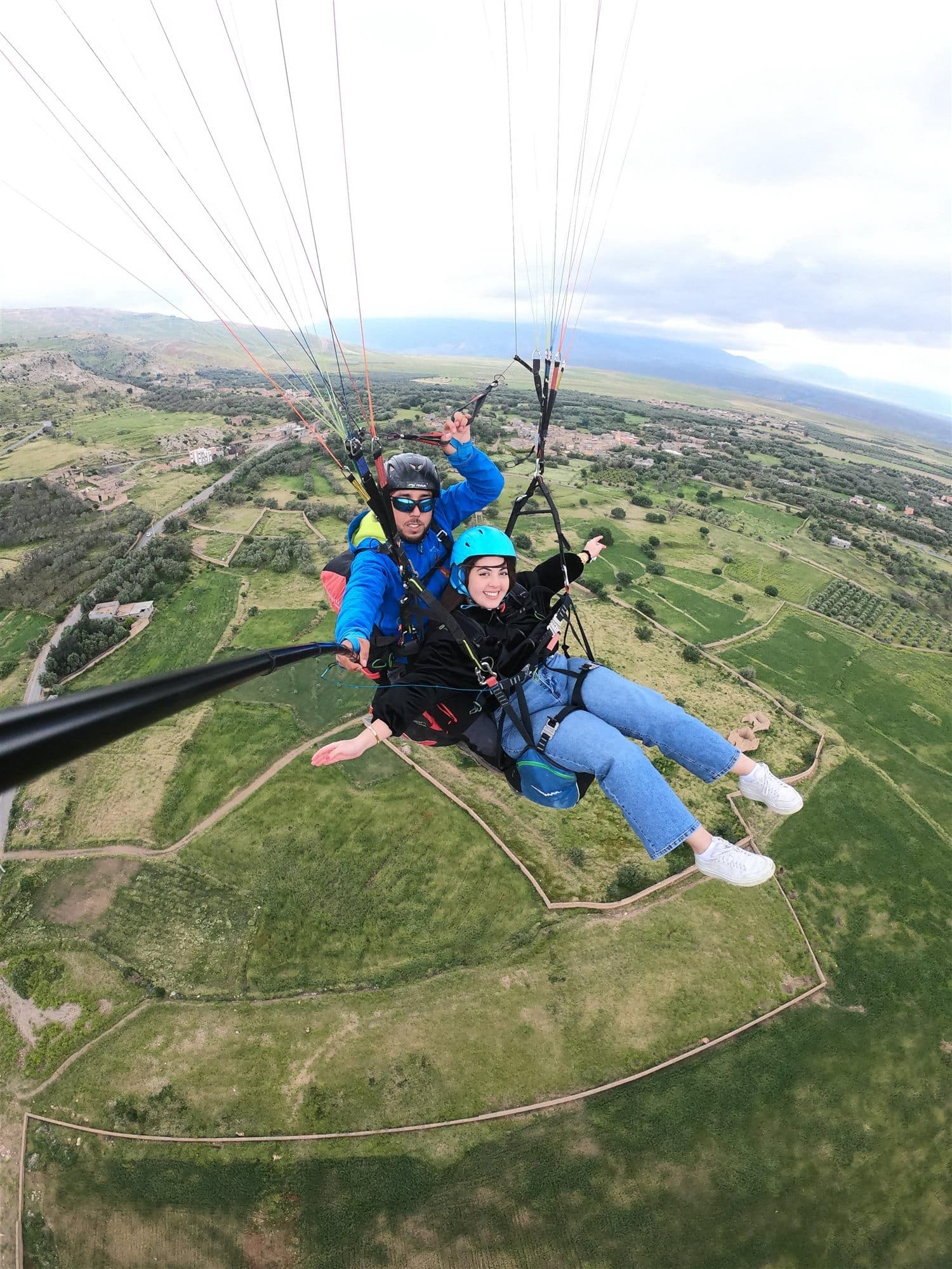 Professional tandem paragliding flight above the Atlas foothills near Marrakech.